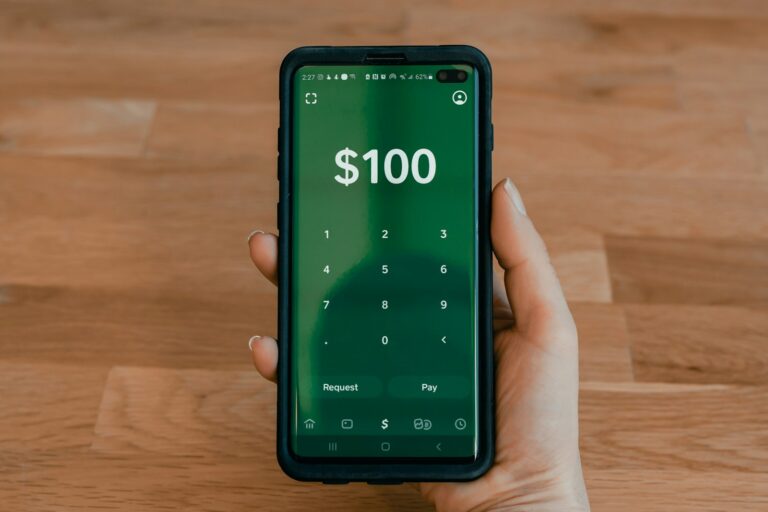 person holding black android smartphone; money-making apps for beginners
