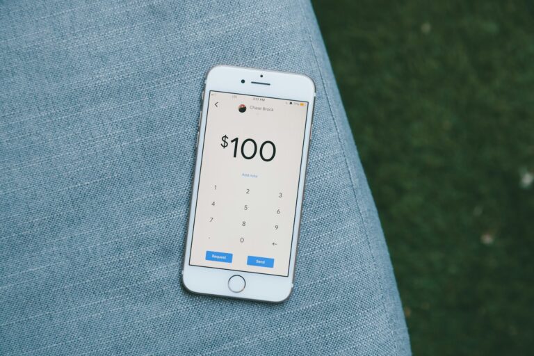 white samsung android smartphone on gray textile; money tracker app